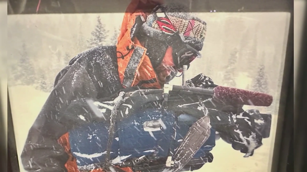 john-mason-with-camera-in-the-snow.png 