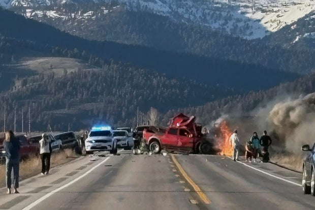 Rescue workers arrive at the scene of a deadly collision between a pickup truck and tour van near Henry's Lake State Park in eastern Idaho, May 1, 2025.