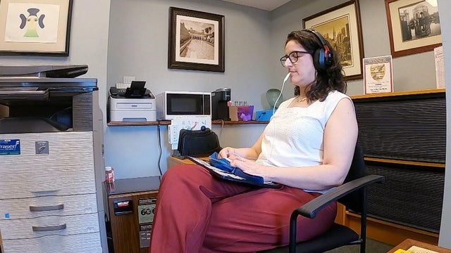 A patient uses the Lenire device for her tinnitus 