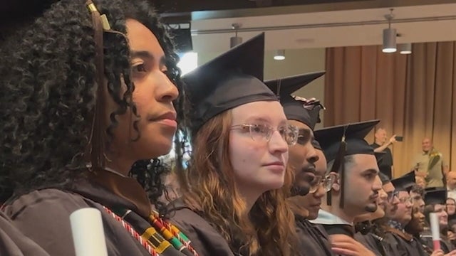 Students look toward the stage during graduation 