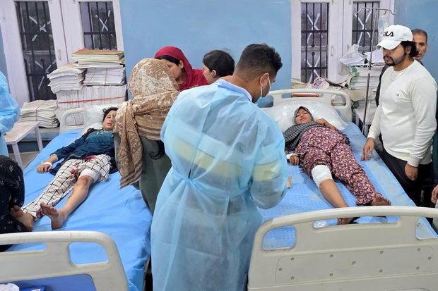 Girls who, according to their relatives, were injured in a cross border shelling in Uri sector receive treatment in a hospital