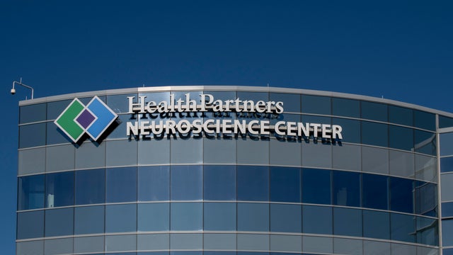 Logo of the Health Partners Neuroscience Center against a blue sky. 