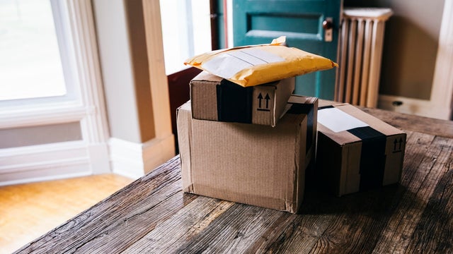 Stack of packages on table at home 