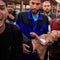 Palestinians inspect the damage at the European Hospital, in Khan Younis 