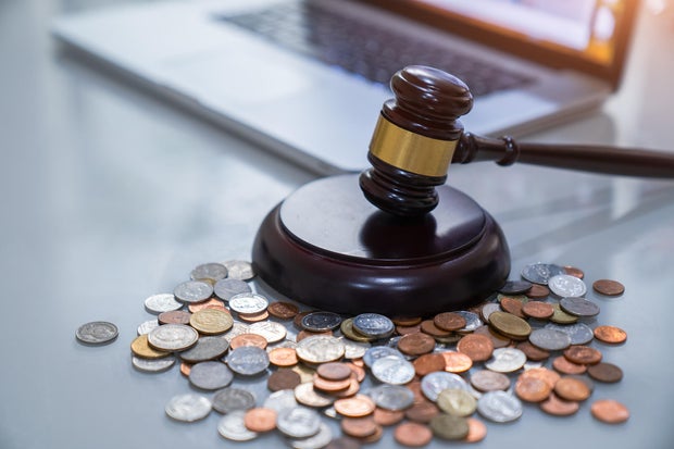 Judge's gavel and money, financial law