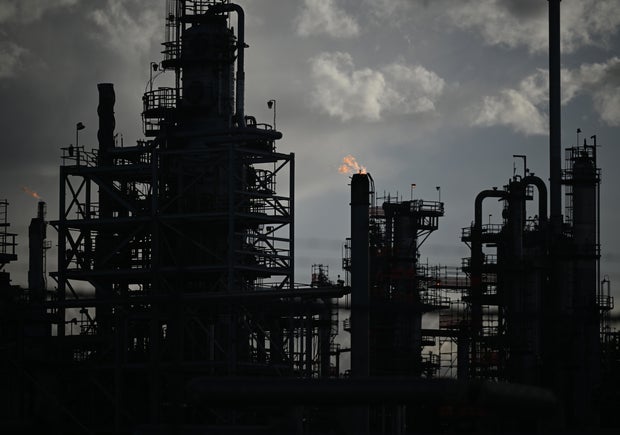 Community members and environmental advocacy groups gather to discuss their concerns with Suncor refinery 