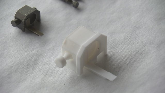 Two switches are shown, both are small, one is made of plastic 