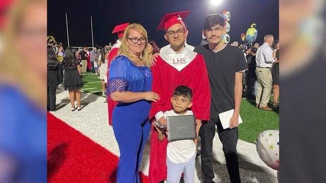 Brothers Jose and Josue Trejo Lopez, their mom and their younger brother at Jose's high school graduation. 