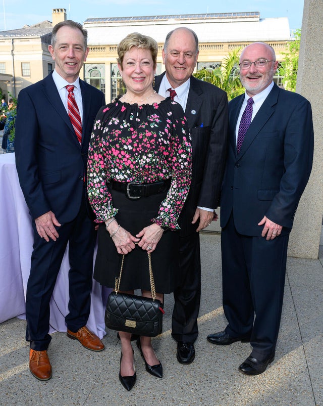 People pose for a photo at a gala for Nemours 