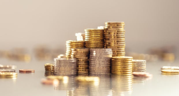 Towers made out of gold and silver Euro coins.