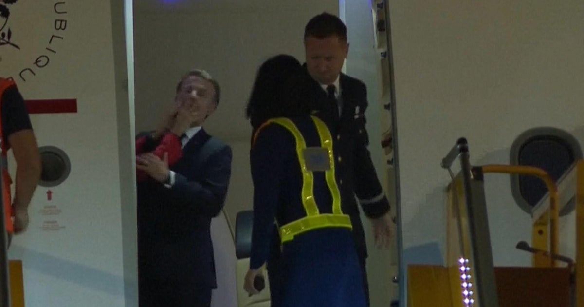 French President Emmanuel Macron responds to video of what appears to be wife shoving him  www.cbsnews.com