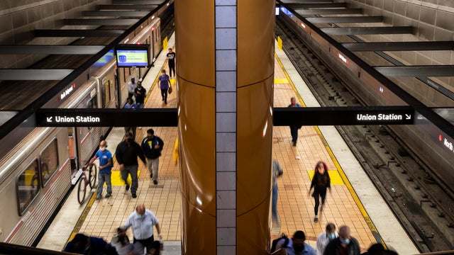Riders exit a METRO Red Line train 