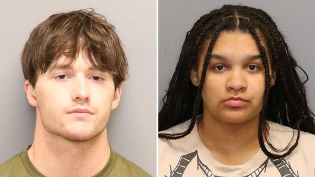2 arrested after body found in burned vehicle 