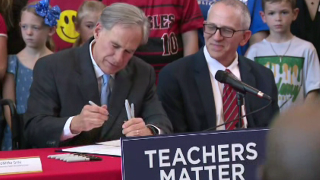 abbott-signs-bill.png 