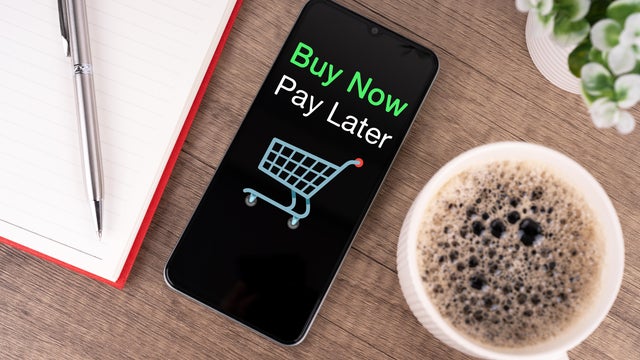 High Angle View of Smartphone with Text Buy Now Pay Later Shopping 