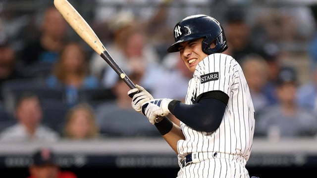 Anthony Volpe #11 of the New York Yankees is hit by pitch for a walk to score a run against the Boston Red Sox during the second inning at Yankee Stadium on June 06, 2025 in the Bronx borough of New York City. 