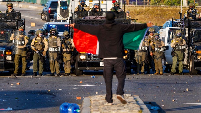 Protesters gather outside of the Federal Building in downtown Los Angeles 