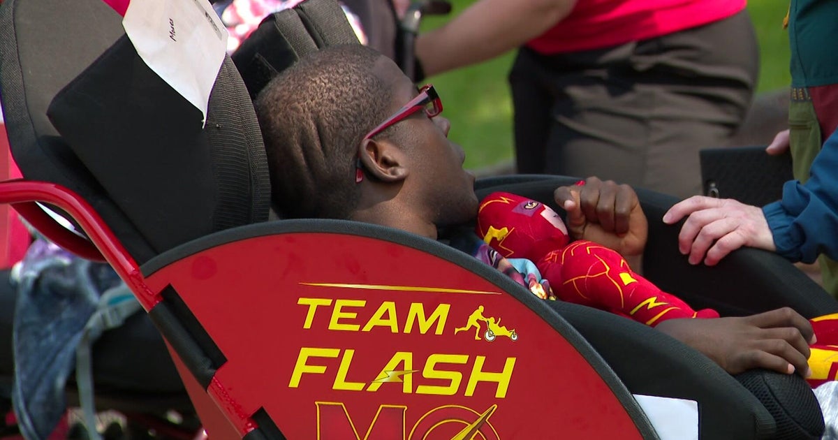Woodbury runner with cerebral palsy gifted customized running chair 