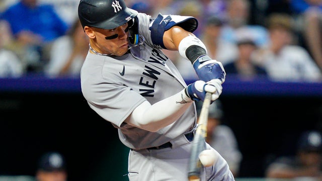 Aaron Judge #99 of the New York Yankees hits a home run during the seventh inning against the Kansas City Royals at Kauffman Stadium on June 11, 2025 in Kansas City, Missouri. 
