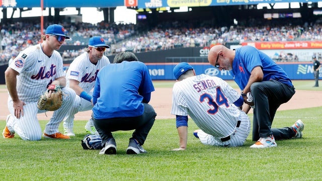 Kodai Senga #34 of the New York Mets is tended to on the field after an injury during the sixth inning against the Washington Nationals at Citi Field on June 12, 2025 in New York City. 