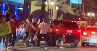Riverside police search for driver who crashed into protester 