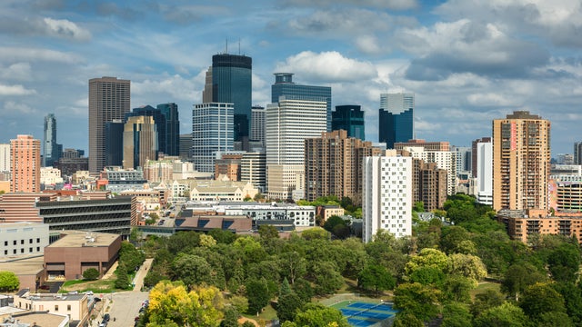 Drone Shot Looking Over Loring Park Towards Downtown Skyscrapers 