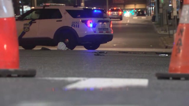 Police and traffic cones are seen on North Broad Street near the scene of the hit-and-run 