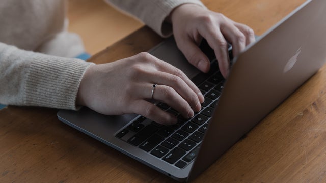 Person uses laptop 