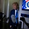President Trump speaks to reporters aboard Air Force One 