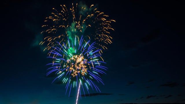Independence Day 4th of July fireworks with the Grand Mesa in the background near Delta, Colorado 