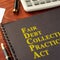 FDCPA Fair Debt Collection Practices Act on a table. 