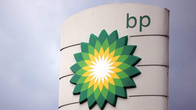 BP logo with a cloudy sky in the background 