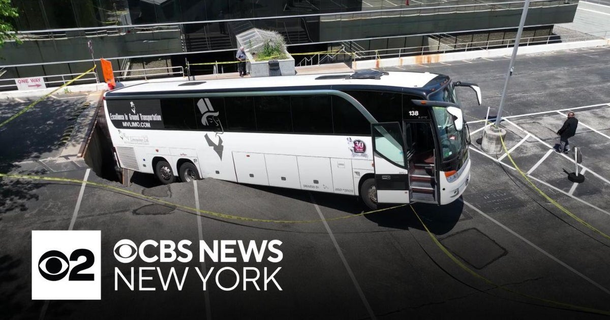 Charter bus remains stuck after sinking into Long Island parking lot ...