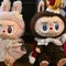 Bezos wedding guest gifts viral Labubu doll