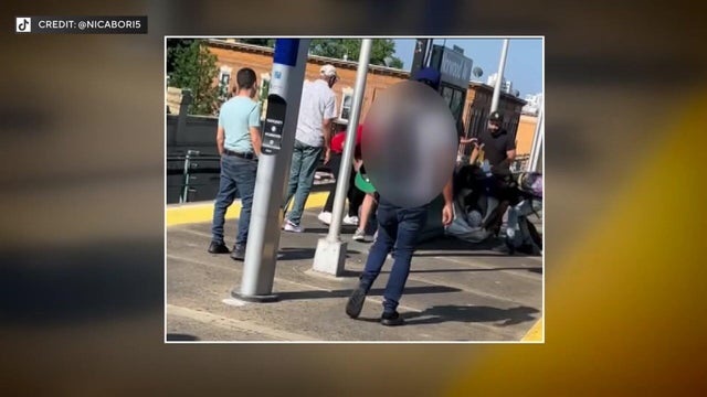 TikTok video shows a group of people pinning a man to the ground on a subway platform. 