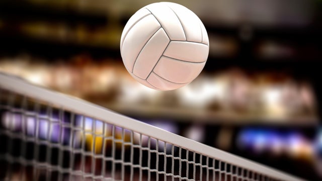 Volleyball ball and net in voleyball arena during a match. 