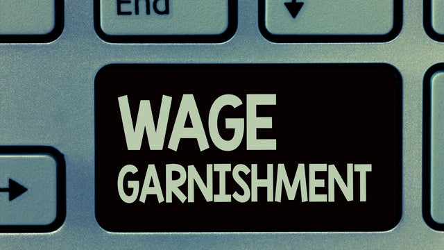 Handwriting text writing Wage Garnishment. Concept meaning Deducting money from compensation ordered by the court 
