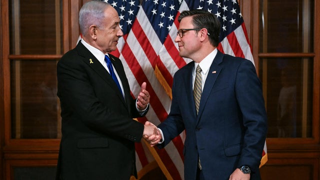 Speaker of the House Mike Johnson shakes hands with Israeli Prime Minister Benjamin Netanyahu as they meet at the US Capitol in Washington, DC, on July 8, 2025. 