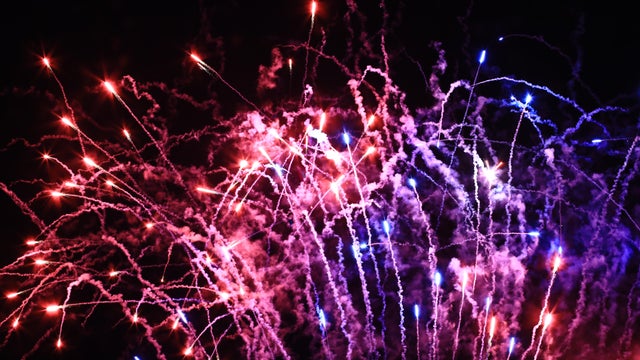 Magical night background with glittering fireworks 
