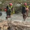 Texas flood rescue crews navigate tough terrain to search for missing