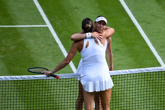 Amanda Anisimova (R) and Aryna Sabalenka after their match at Wimbledon 