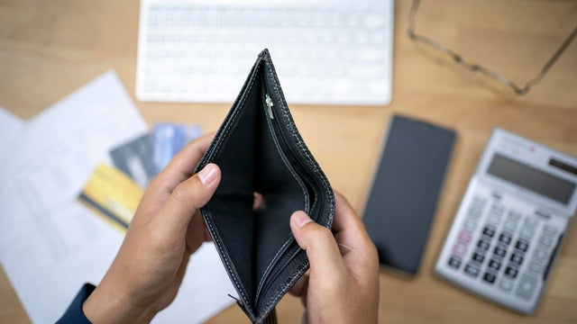 hand open empty purse looking for money having problem bankrupt broke 