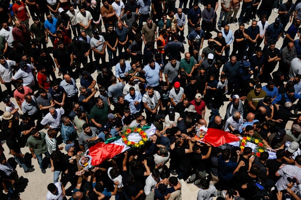 Mourners take part in the funeral of of Sayfollah Kamel Musallet, killed amid the Israel-Gaza conflict, near Ramallah
