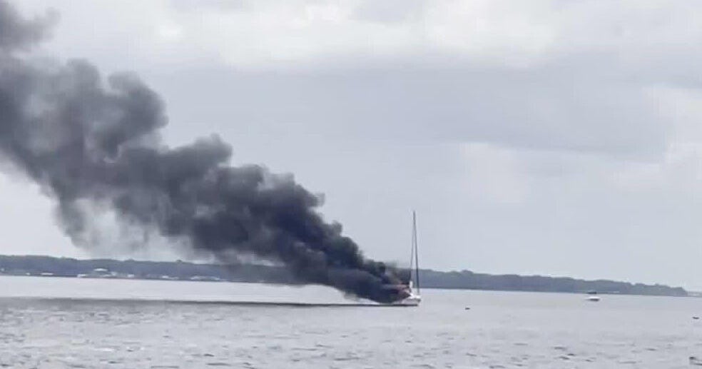 Florida father, son rescue family of 5 and their dog from sailboat fire