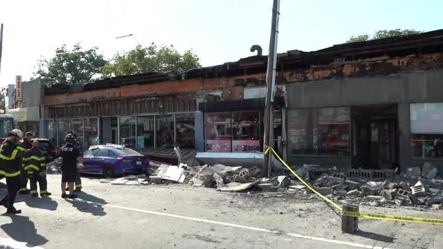 A collapsed facade outside a store in Queens 