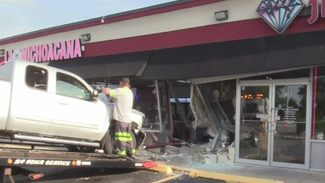 truck into strip mall 