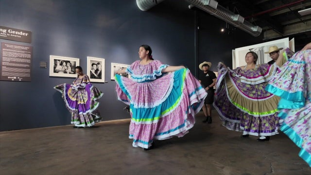 Dancers in Mexican dresses and skirts rehearse 