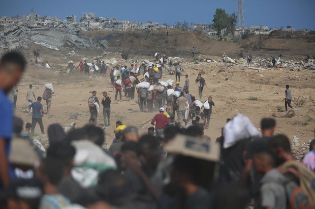 Palestinians scramble for aid in Gaza under Israeli blockade 