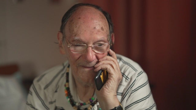 Marvin Marcus speaks on a cell phone 