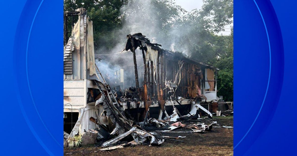 Woman dies, 3 teens escape house fire in Brandon Township 